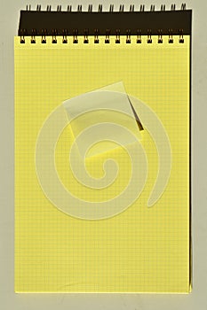 Wire spiral notebook yellow checkered lined paper and yellow sticky note paper