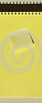 Wire spiral notebook yellow checkered lined paper and yellow sticky note paper