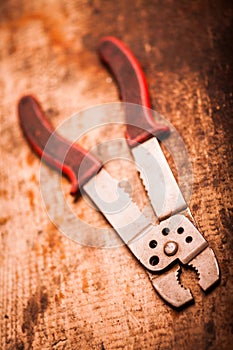 Wire stripper on wooden plank