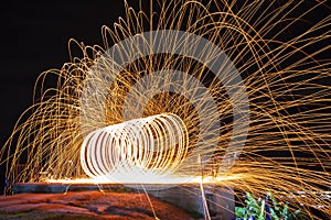 Wire wool. Steel wool spining firework . Funny fire and burning steel.