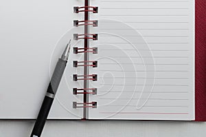 Wirebound Notebook with Black Pen.