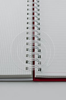 Wirebound Notebook Open with Lined and Grid Paper.