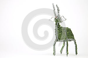 Wired and beaded African animal Craft of a Buck isolated on a white background