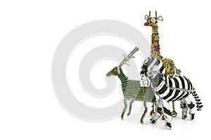 Wired and beaded African animal Craft of a Zebra, girafe and buck isolated on a white background