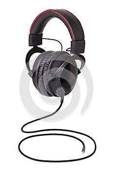 Wired black professional headphones isolated on white background