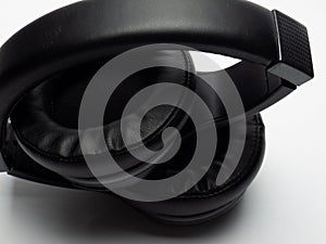 Wireless black headphones on a white background