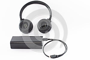 Wireless bluetooth headphones on a white background with a power bank.
