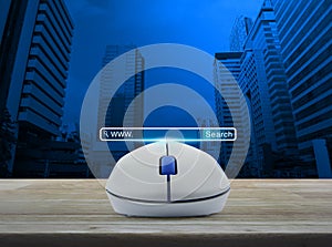 Wireless computer mouse with search www button on wooden table o