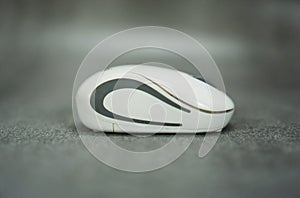 wireless computer mouse side view isolated on gray background