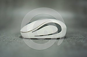 wireless computer mouse side view isolated on gray background
