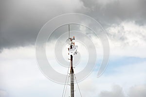 Wireless data station aerial view Against a cloudy sky. Cell tower