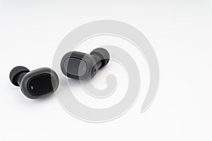 Wireless earbuds or earphones on white background