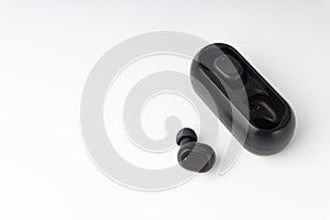 Wireless earbuds or earphones on white background