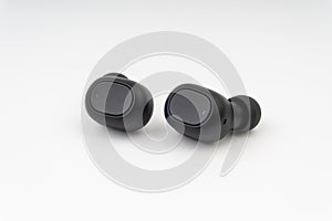 Wireless earbuds or earphones on white background photo