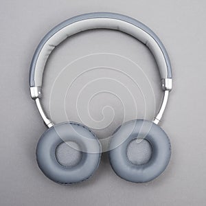 Wireless headphones on a neutral background
