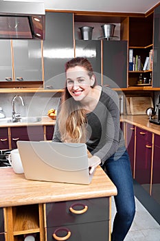 Wireless home concept - joyous beautiful young woman standing for wellbeing