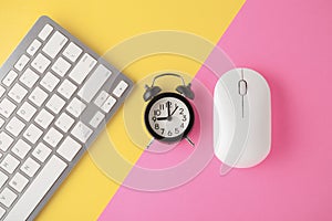 Wireless keyboard and mouse with clock on yellow pink background