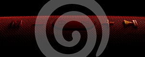 Wireless music column. Red bluetooth speaker on black background.