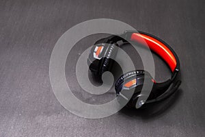 Wireless Over-Ear full size Headphones, Black leather isolated on black background with clipping path.