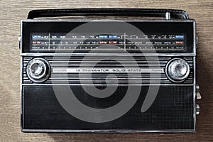 Wireless technology. An old radio on wooden background. Radio broadcasting. Musical record.