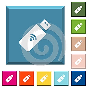 Wireless usb stick white icons on edged square buttons photo