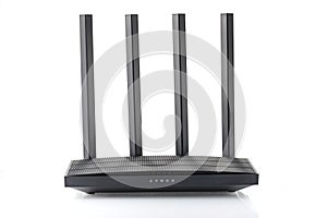 Wireless wi-fi black router with four antennas isolated on white. High speed internet connection, firewall network and