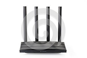 Wireless wi-fi black router with four antennas isolated on white. High speed internet connection, firewall network and