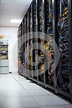 Wires for days on end. Cropped shot of the inside of a computer with all of its wiring located in a server room.