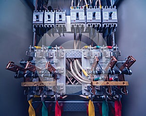 Wires and switches in electric box. Electrical panel with fuses and contactors