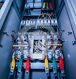 Wires and switches in electric box. Electrical panel with fuses and contactors