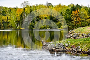 The Wisconsin River with Spring Trees and Rocky shoreline photo