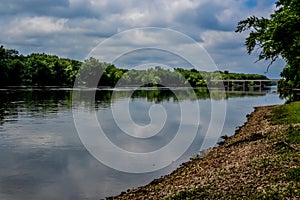 Wisconsin River with Rocky Shoreline and Bridge