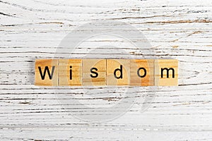 Wisdom word made with wooden blocks concept