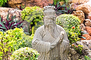 Wise man statue in garden