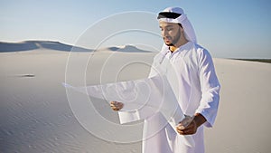 Wise Muslim Arabian UAE Sheikh construction guy inspects area an