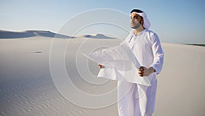 Wise Muslim Arabian UAE Sheikh construction guy inspects area an