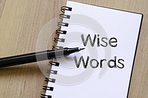 Wise words concept on notebook