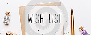 wish list note with envelope  gifts and gold glitter stars on white background. merry christmas and New Year concept