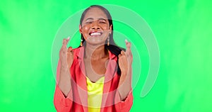 Wish, woman with her fingers crossed for hope and against a green screen for competition. Giveaway or good luck, mockup