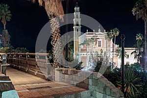 The Wishing Bridge and St. Peter& x27;s Church at night in old city Yafo, Israel.