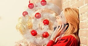 Wishing everyone merry christmas. Christmas wishes concept. Woman pretty peaceful dreamy face hold smartphone enjoy