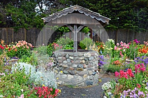 Wishing well in dahlia garden