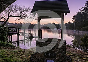 Wishing well overlooking Kerikeri Inlet with morning mist over w