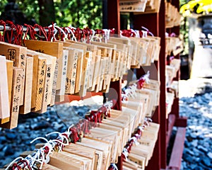 Wishing wood tags hanging in Japanese Shinto shrine photo