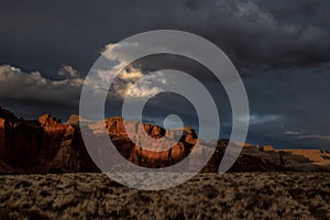 Wisp of Cloud Catches the Waning Sunlite Over Capitol Reef