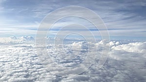 Clouds against the blue sky from the airplane window