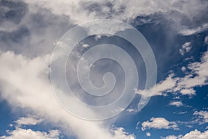 Wisps of White Cloud on Deep Blue Sky