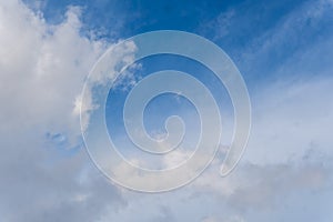 Wispy Cirrus Clouds in a Bright Blue Sky Background