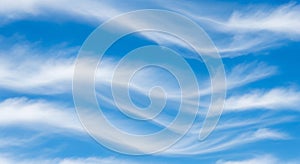 Wispy Clouds Drape a Vibrant Blue Sky