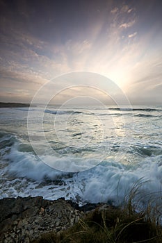 Wispy sky across sea photo